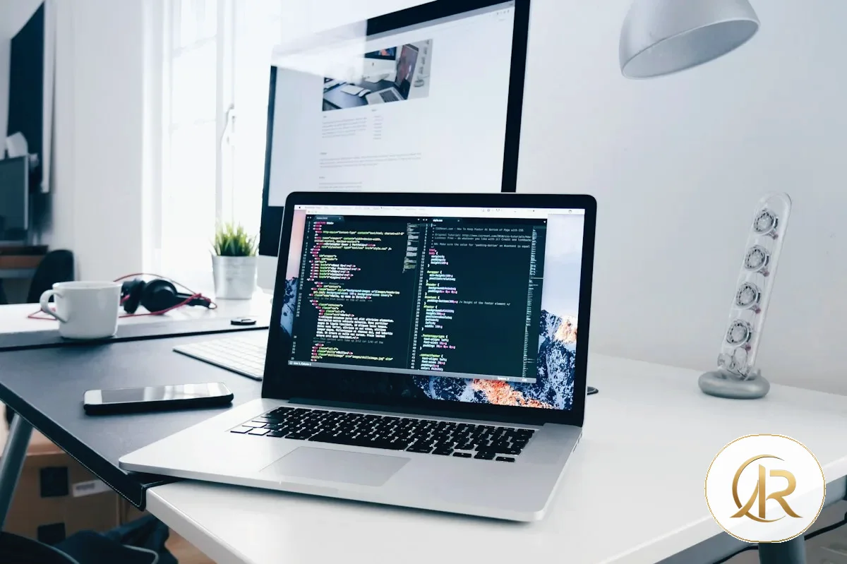 Developer using a laptop to review website structure and improve a content page