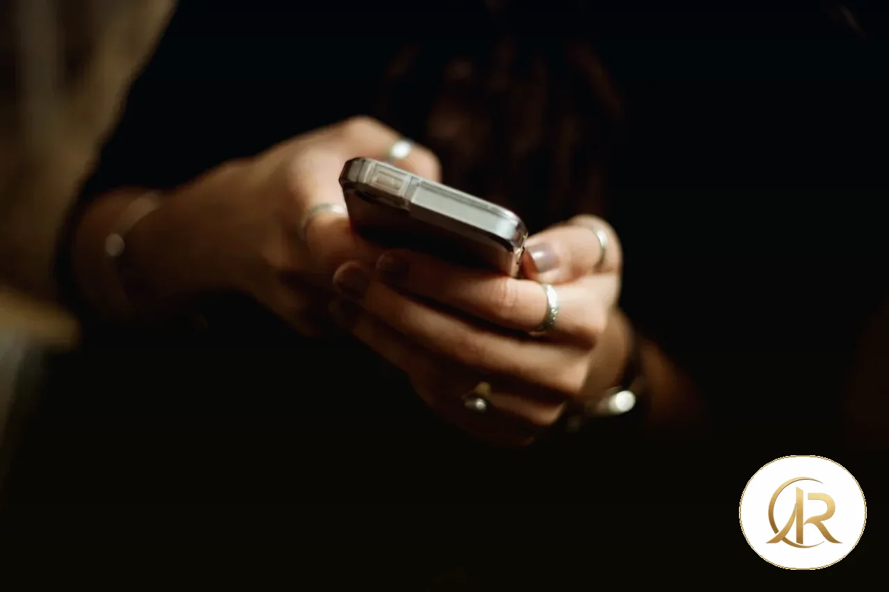 Person using a smartphone to review long text and localized interface labels